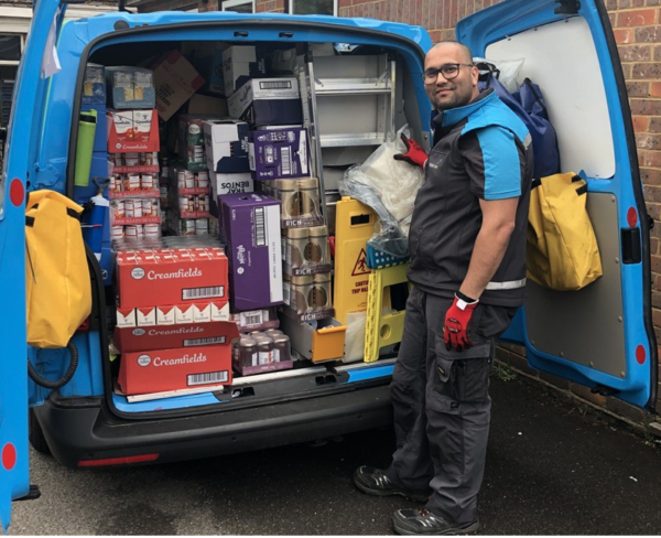 MHF volunteer loading van with food and supplies