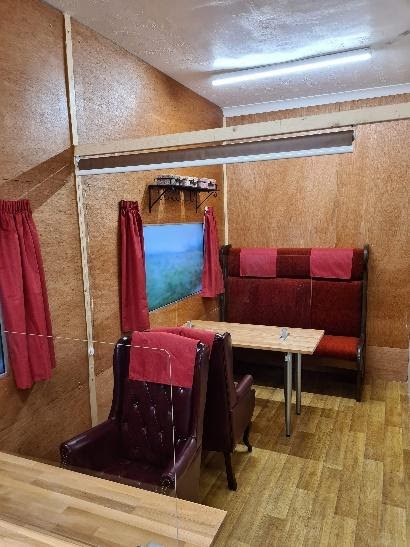 Award-Winning TV and Film Set Builder Delights Care Home Residents With Train Carriage to Help Them Meet Family Safely