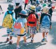 Group of children wearing backpacks