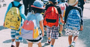 Group of children wearing backpacks